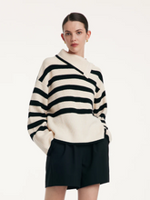 a lady in black and white wool loose striped sweater